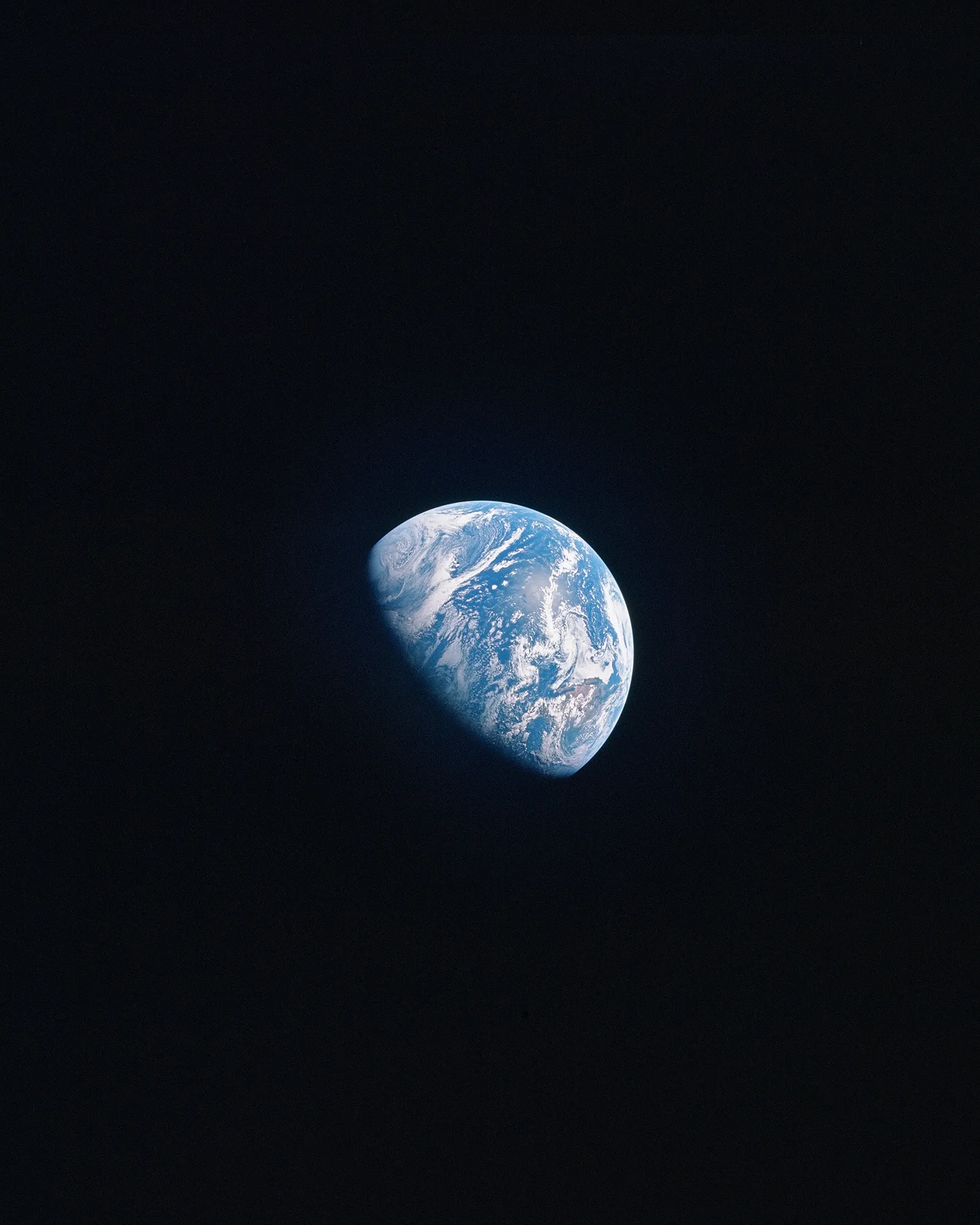 A distant view of Earth in space, symbolizing exploration and limitless potential
